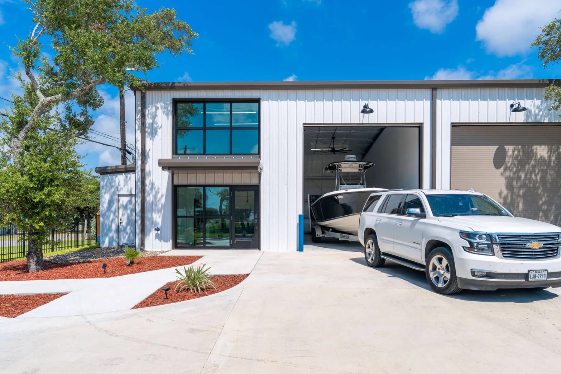 A completed SIDE BY SIDE® garage condo with a boat inside